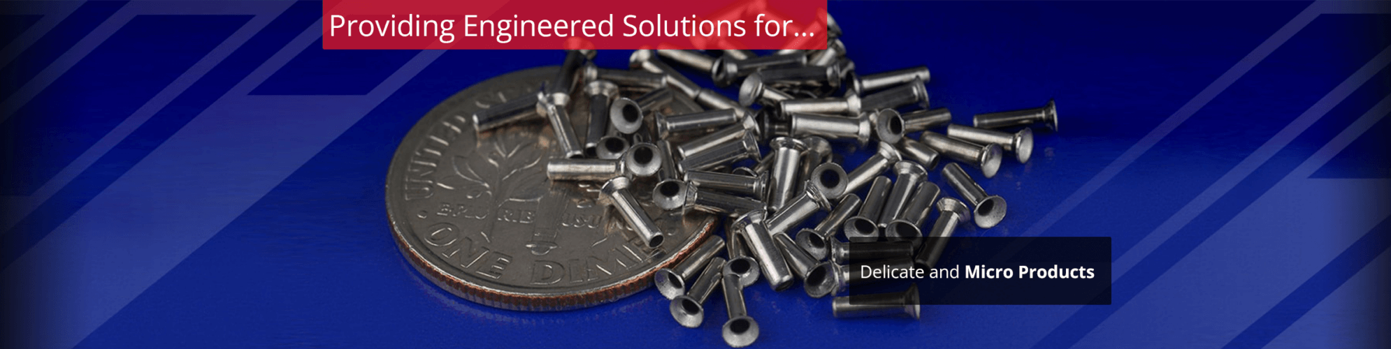 Coin and small metal parts on blue background highlighting work on delicate metal products